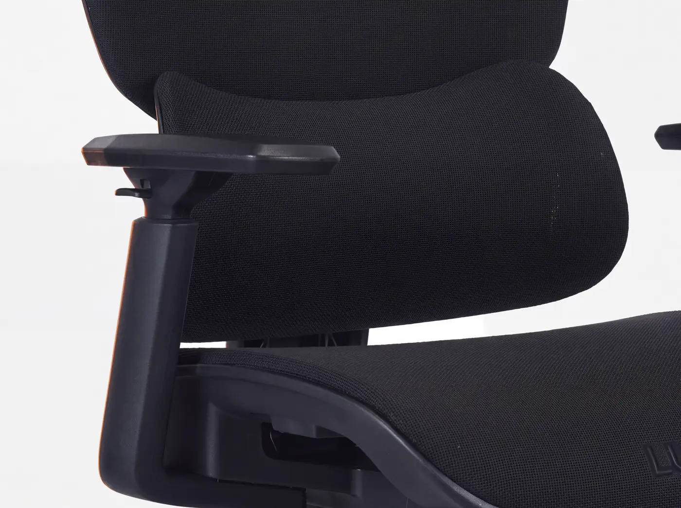 Close-up of the padded armrest and seat on the EOS LUX 500 gaming chair